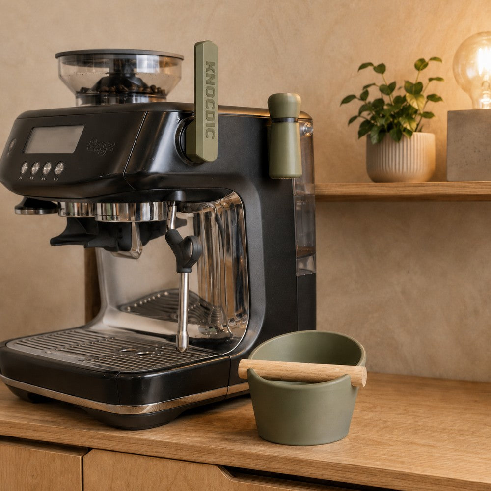 Olive green KNOCDIC Sage/Breville accessories with matching knock box in a warm home espresso setup