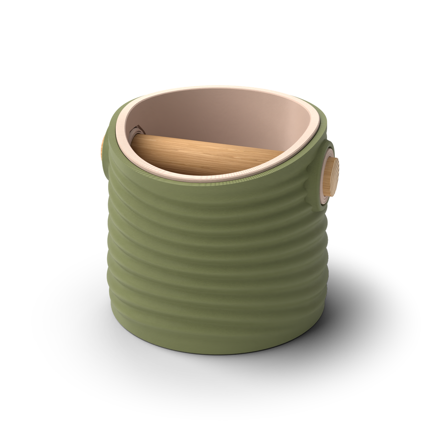 Ripple tapered round espresso knock box with an Olive Green rippled shell, a lift-out Latte Brown inner bin and a solid oak knock bar with Knock Caps