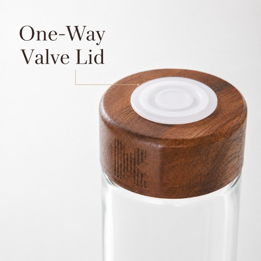 One-way valve lid on glass coffee bean storage tube