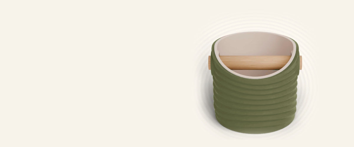 Ripple espresso knock box with an Olive Green rippled shell, a lift-out Latte Brown inner bin and a solid oak knock bar