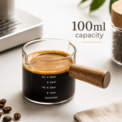100ml glass coffee measuring cup filled with espresso