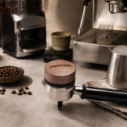 Walnut espresso distribution tool on portafilter in a home espresso coffee station setup