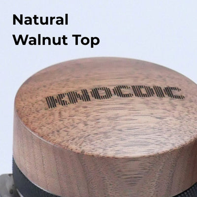 Close-up of natural walnut wood top on adjustable espresso distribution tool