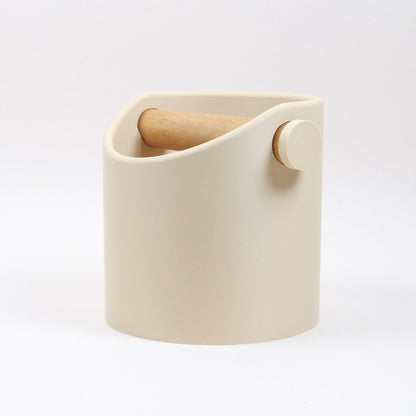 Beige ceramic container with wooden handle on a white background