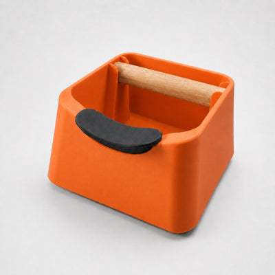 The Pod 3-in-1 Espresso Knock Box & Portafilter Tamping Stand in matte orange