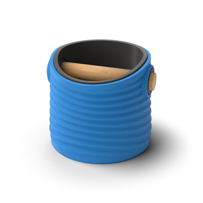 Ripple tapered round espresso knock box with a Marine Blue rippled shell, a lift-out Charcoal inner bin and a solid oak knock bar with Knock Caps