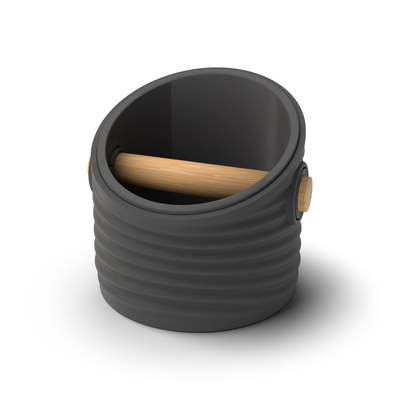 Ripple angled-top round espresso knock box with a Charcoal rippled shell, a lift-out Charcoal inner bin and a solid oak knock bar with Knock Caps