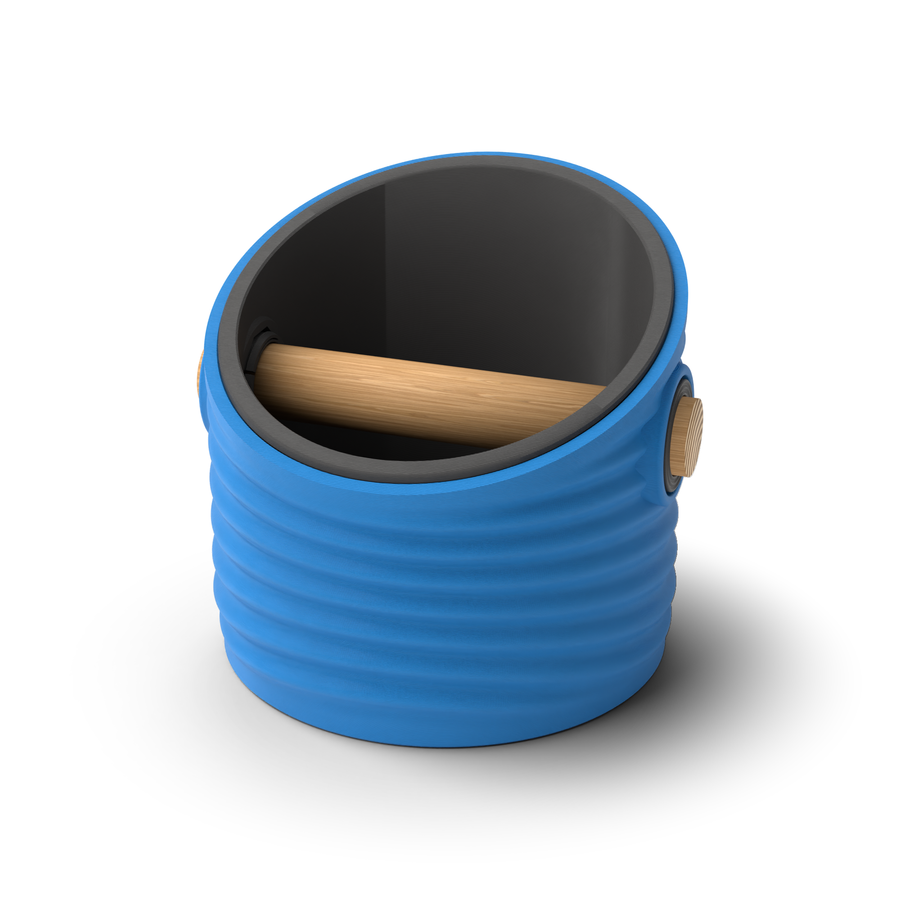 Ripple angled-top round espresso knock box with a Marine Blue rippled shell, a lift-out Charcoal inner bin and a solid oak knock bar with Knock Caps