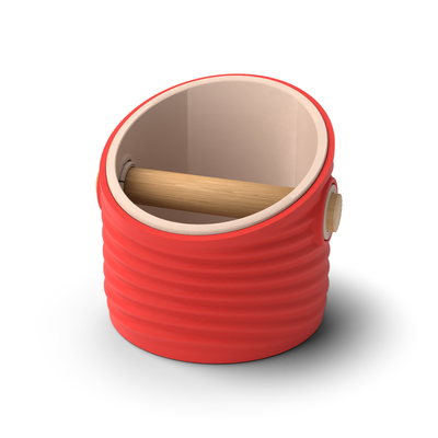 Ripple angled-top round espresso knock box with a Scarlet Red rippled shell, a lift-out Latte Brown inner bin and a solid oak knock bar with Knock Caps
