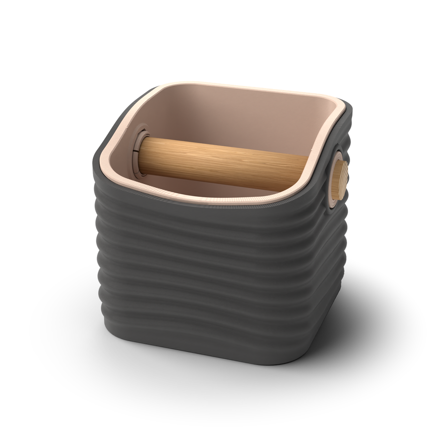 Ripple rounded square espresso knock box with a Charcoal rippled shell, a lift-out Latte Brown inner bin and a solid oak knock bar with Knock Caps