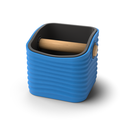 Ripple rounded square espresso knock box with a Marine Blue rippled shell, a lift-out Charcoal inner bin and a solid oak knock bar with Knock Caps
