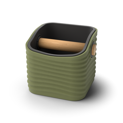 Ripple rounded square espresso knock box with an Olive Green rippled shell, a lift-out Charcoal inner bin and a solid oak knock bar with Knock Caps