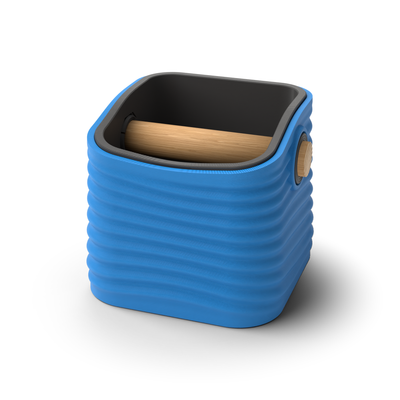 Ripple tapered square espresso knock box with a Marine Blue rippled shell, a lift-out Charcoal inner bin and a solid oak knock bar with Knock Caps