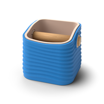 Ripple tapered square espresso knock box with a Marine Blue rippled shell, a lift-out Latte Brown inner bin and a solid oak knock bar with Knock Caps
