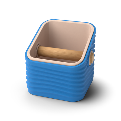 Ripple angled-top square espresso knock box with a Marine Blue rippled shell, a lift-out Latte Brown inner bin and a solid oak knock bar with Knock Caps