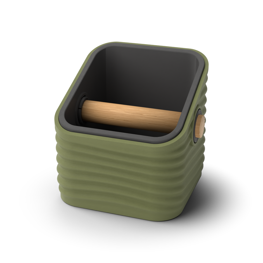 Ripple angled-top square espresso knock box with an Olive Green rippled shell, a lift-out Charcoal inner bin and a solid oak knock bar with Knock Caps