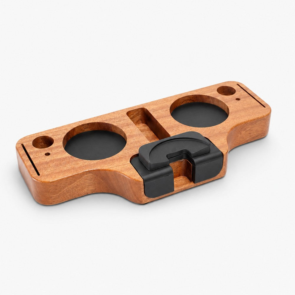 Wooden portafilter holder with black clip on a white background