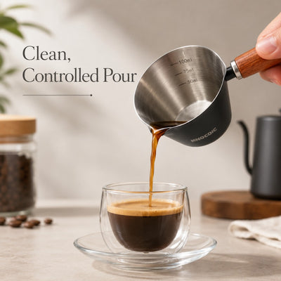 Barista measuring cup used for espresso shot measuring