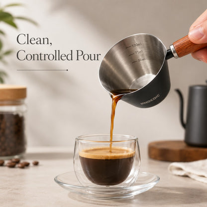 Barista measuring cup used for espresso shot measuring