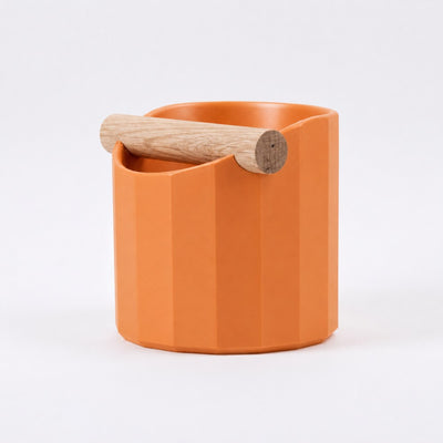 Facet Geometric Espresso Knock Box with real wood bar in matte orange