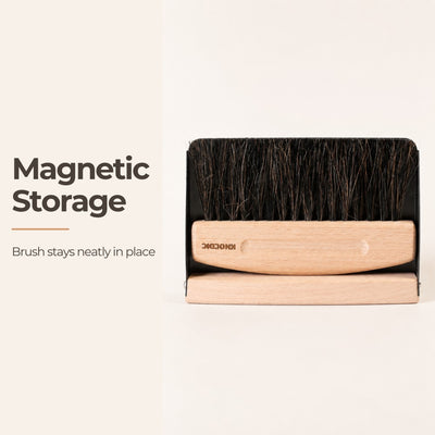 Wooden brush with magnetic storage feature on a light beige background