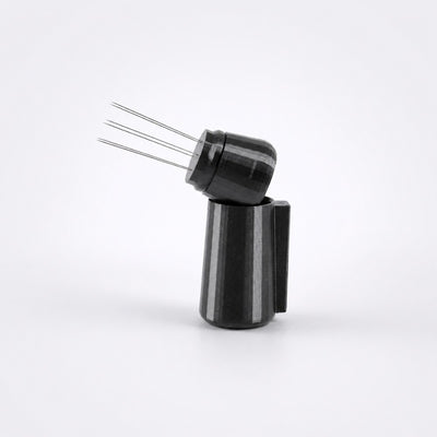 KNOCDIC metallic black espresso WDT tool resting inside its custom integrated magnetic docking holder.
