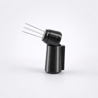 KNOCDIC metallic black espresso WDT tool resting inside its custom integrated magnetic docking holder.