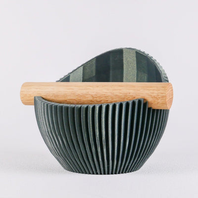 KNOCDIC Nova sculptural espresso knock box in galaxy green with a ribbed texture and real oak wood bar.