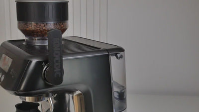 KNOCDIC matte black espresso WDT tool resting inside its custom integrated magnetic docking holder.