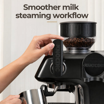A home barista using an extended custom lever to smoothly activate the steam wand on a Barista Pro espresso machine.