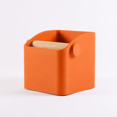 The Square Minimalist Espresso Knock Box in matte orange