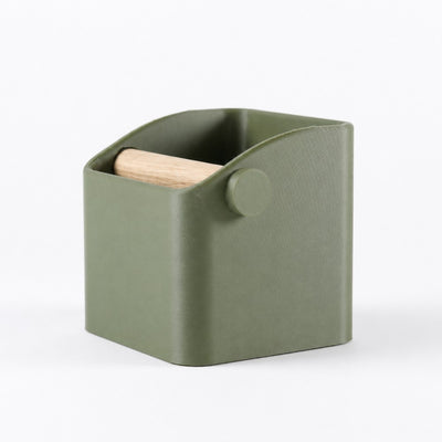 KNOCDIC Square minimal espresso knock box in matte olive green featuring a crisp geometric body and solid oak wood bar.