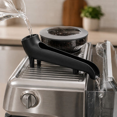 Water tank filler funnel pouring water into rear tank of espresso coffee machine