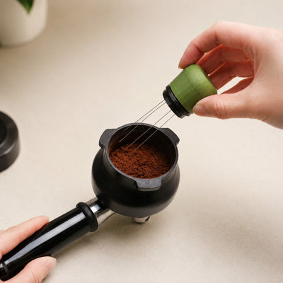 KNOCDIC olive green espresso WDT tool resting upright inside its matching custom 3D printed standing holder.